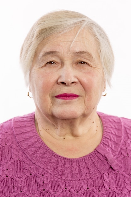 Cute old woman with gray curly hair smiling