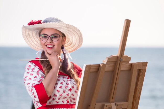 Cute pinup girl in the beach