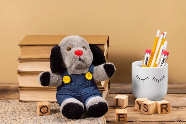 Photo cute plush toy and books arrangement