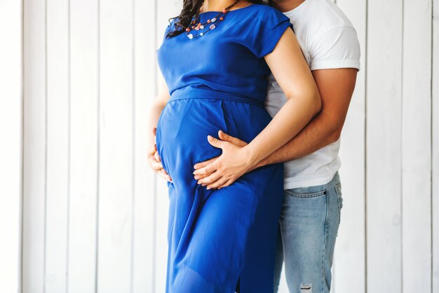 Cute pregnant woman hug with her husband