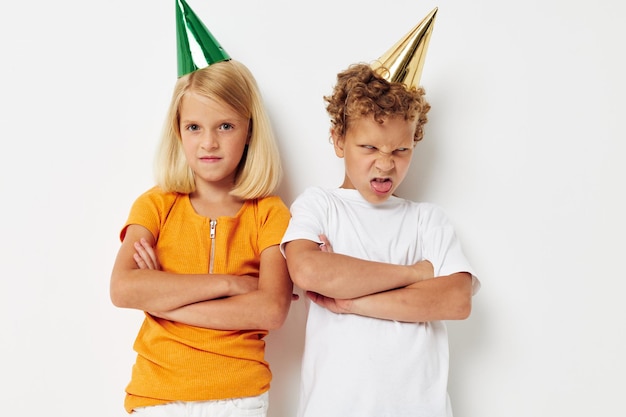 Cute preschool kids in multicolored caps birthday holiday emotion lifestyle unaltered