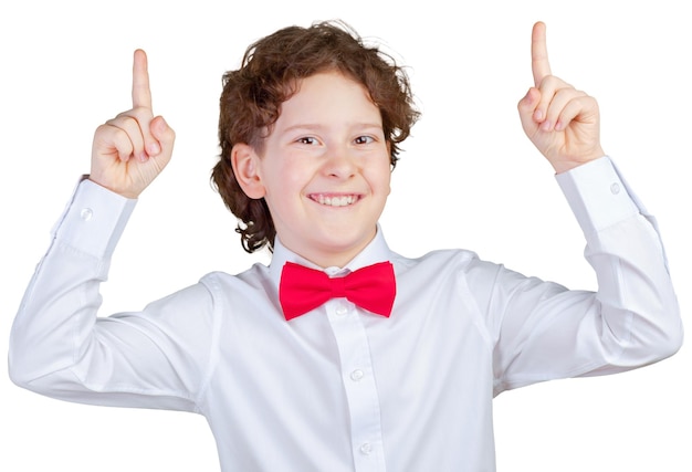 Cute preteen schoolboy pointing up