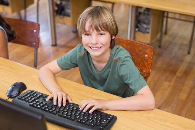 Cute pupil in computer class