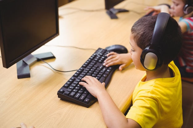 Cute pupil in computer class 