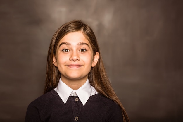 Photo cute pupil smiling at camera