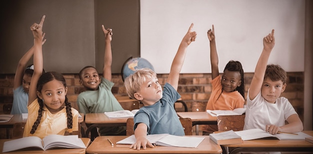 Cute pupils raising their hands