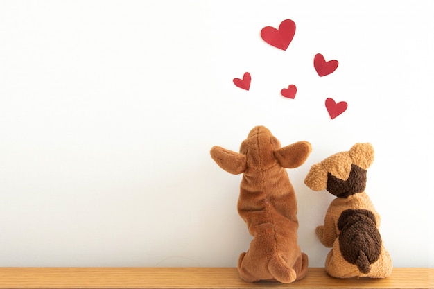 Photo cute puppys with red heart balloons