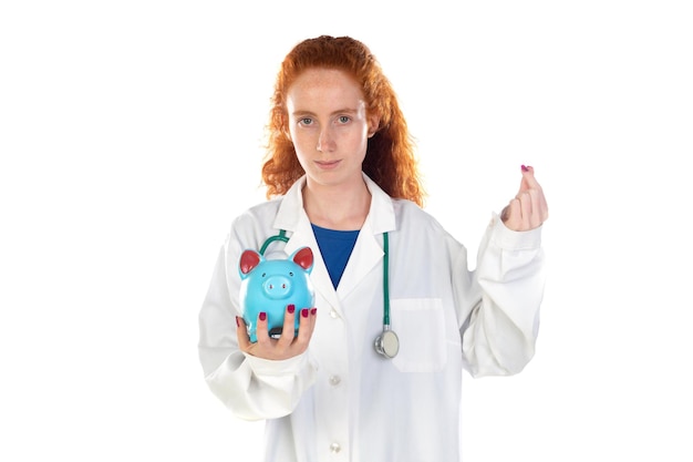 Cute redhead doctor in lab coat saving money