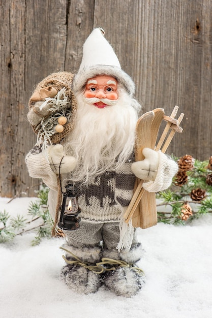 Cute Santa Claus with christmas tree and gifts