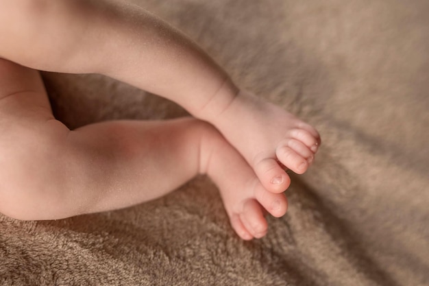 Cute sleeping newborn feet of a small child