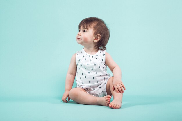 Cute small girl crawling sitting