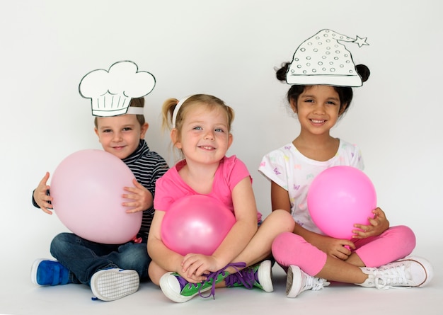 Cute small kids with balloons