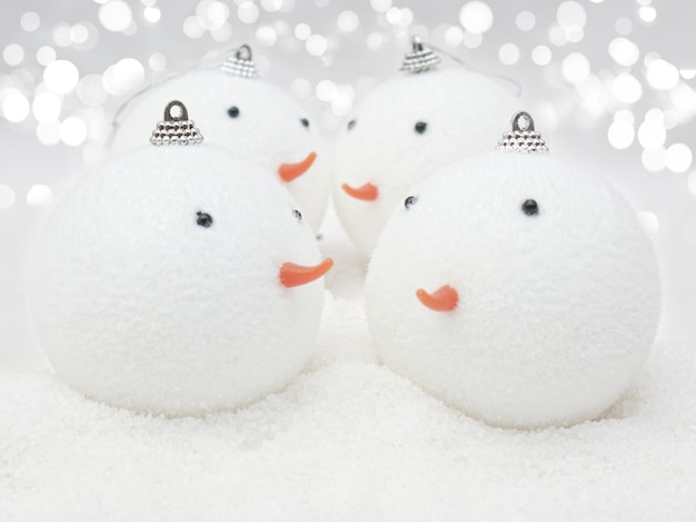 Cute Snowman baubles in snow