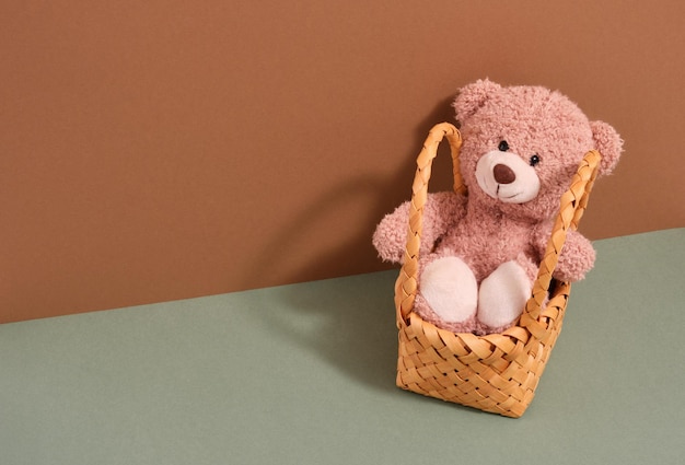 Photo cute soft teddy bear and basket play time copy space for text