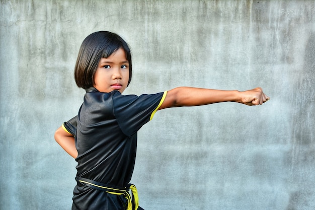 Cute sport girl practicing wushu