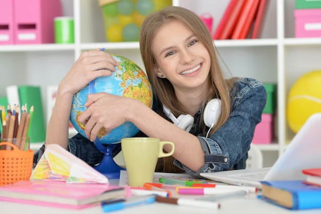 Cute  student girl at class with laptop