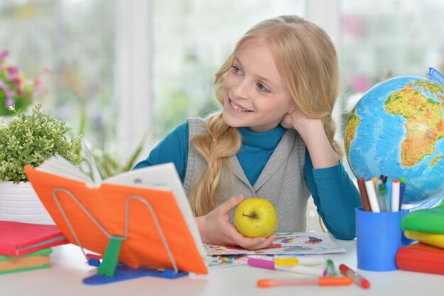 Cute  student girl  with book at class