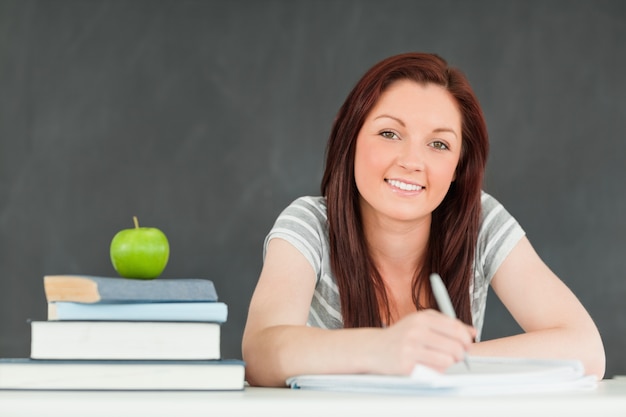 Cute student taking notes