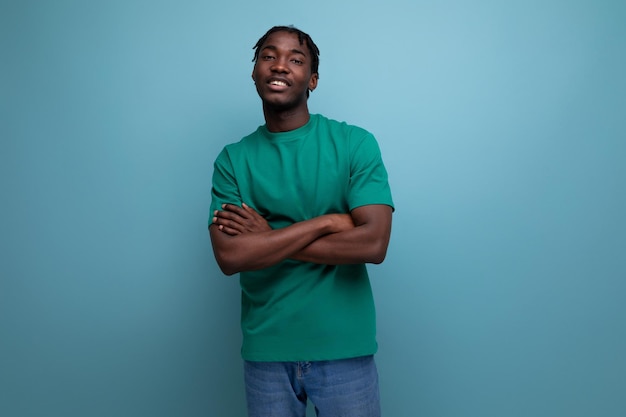 Cute stylish american guy in a tshirt on a blue background