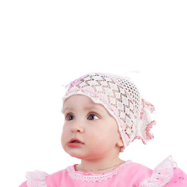 Cute sweet little baby girl looking up on white background