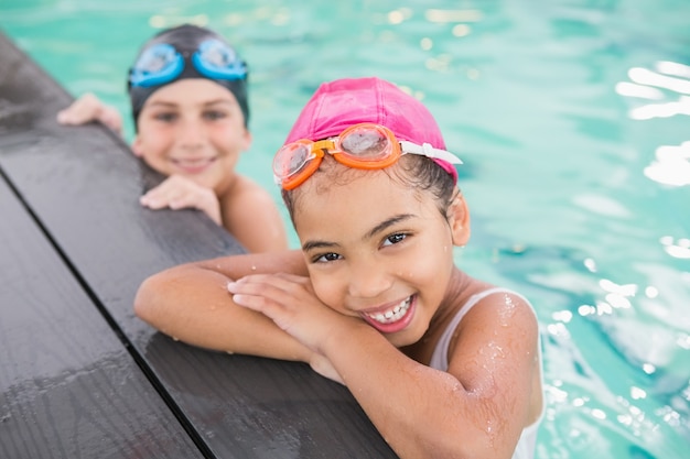 Cute swimming class in the pool at the leisure center