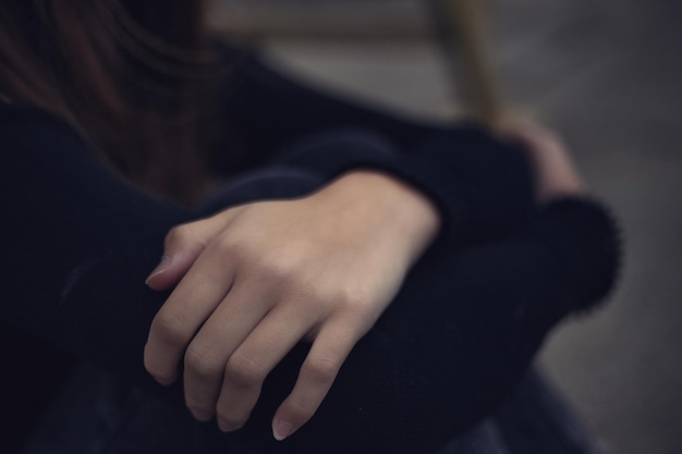 Cute teen girl folded her arms across her chest