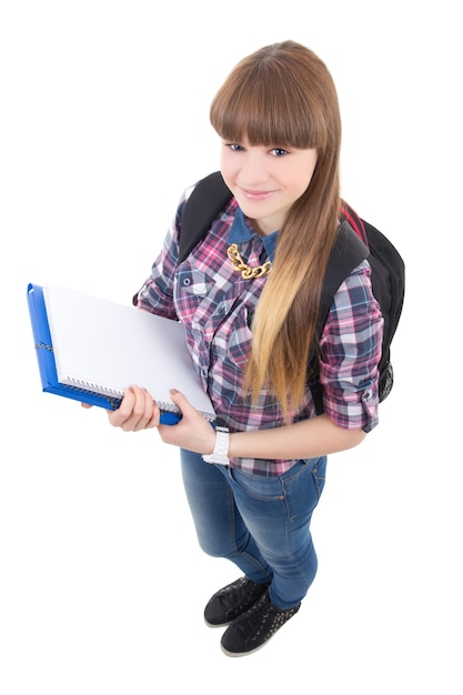 白い背景で隔離のバックパックとかわいい10代の少女