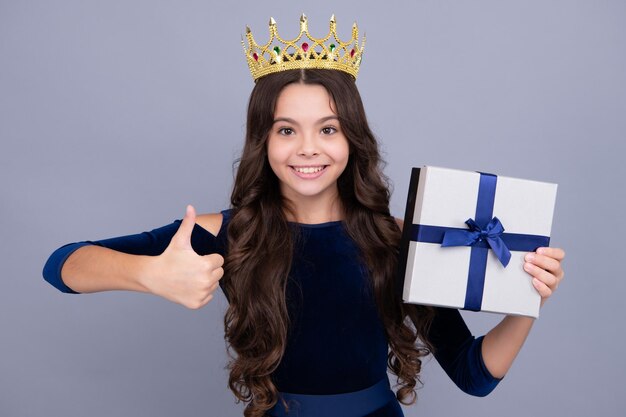 Cute teenager child girl congratulate with valentines day giving romantic gift box Present greeting and gifting birthday concept Happy face positive and smiling emotions of teenager girl