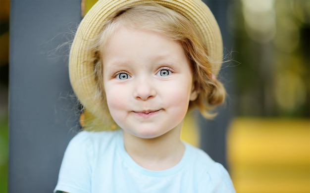 Cute toddler girl outdoors portrait in summer day