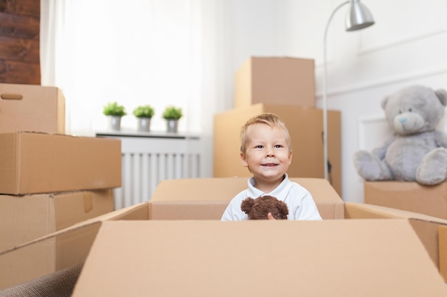 Cute toddler helping out packing boxes