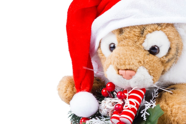 Cute toy tiger with Christmas wreath