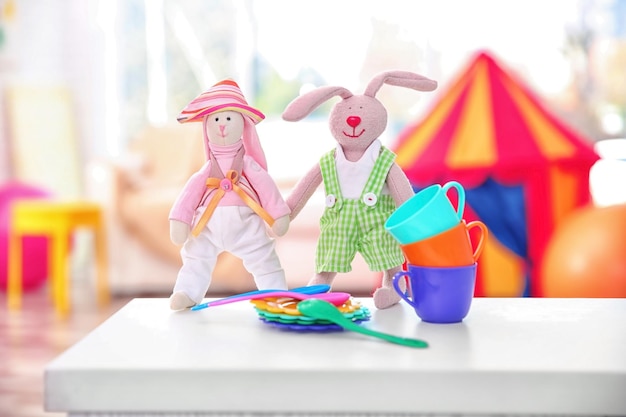 Cute toys on table in baby room