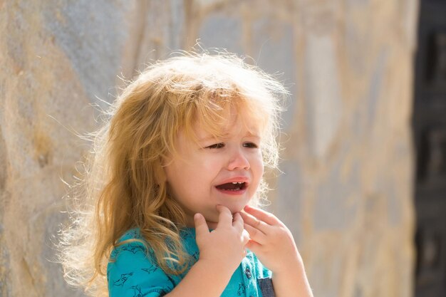 Cute unhappy baby boy crying