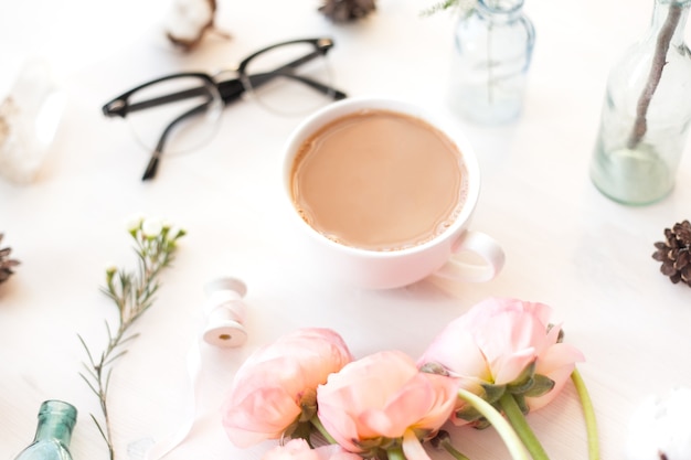 Cute vintage photography with flowers, petals an leaves Flat lay top view. Minimalistic photo for blogs, websites, social media platforms.