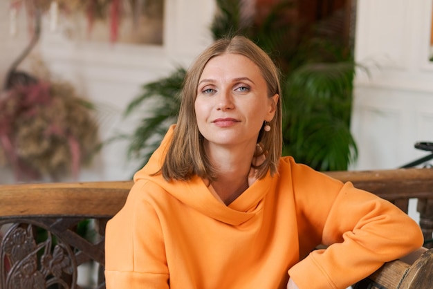 Cute woman in cafe portrait beautiful woman alone at table in cafe concept waiting for an order in a