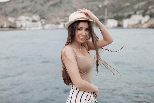 cute woman in casual wear and hat outdoor