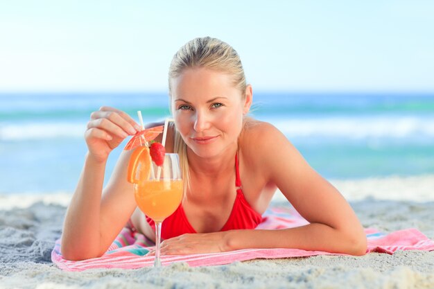 Cute woman drinking her cocktail