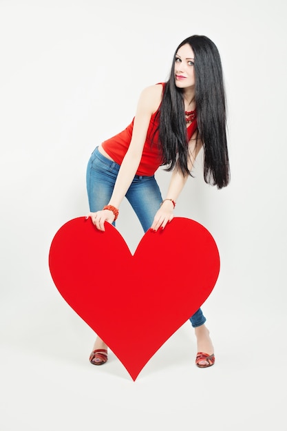 Cute Woman holding Big Red Heart