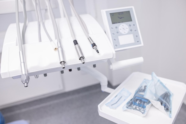 Cute woman sits in dentist chair while dentist examine her teeths Selective focus