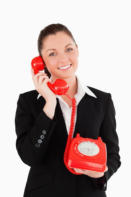 Photo cute woman in suit on the phone