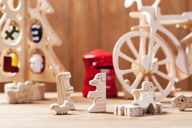 Photo cute wooden toy animal on wood board tiny toys and shallow depth of field