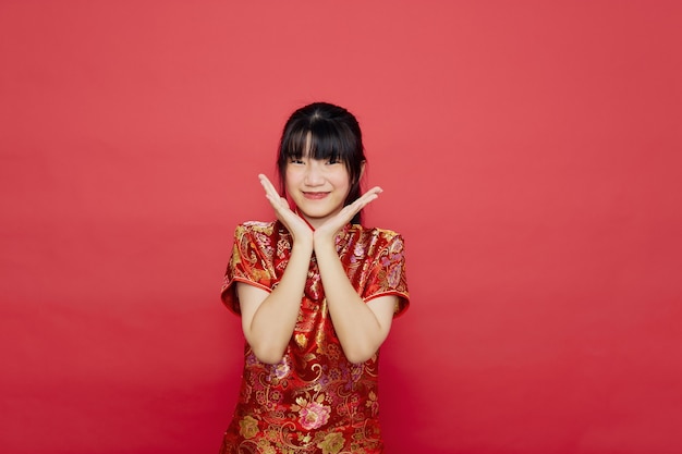 Cute young Asian woman wearing cheongsam