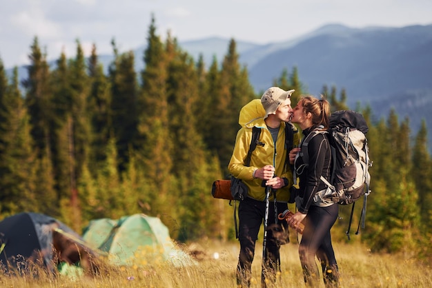 Cute young couple Majestic Carpathian Mountains Beautiful landscape of untouched nature