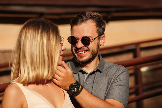 Cute young couple posing outdoors