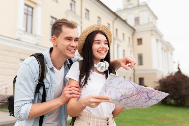 Cute young couple searching for touristic sights