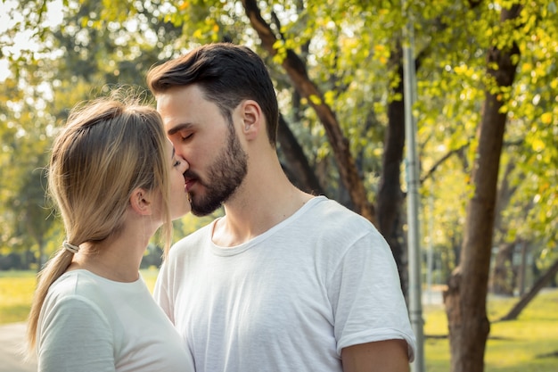 Cute young couple walking in the park