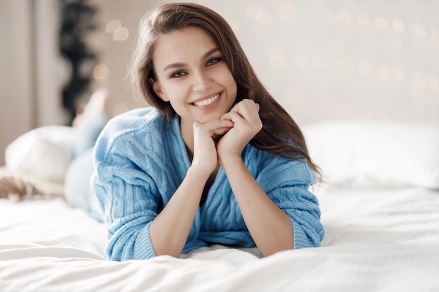 cute young cozy woman indoor portrait