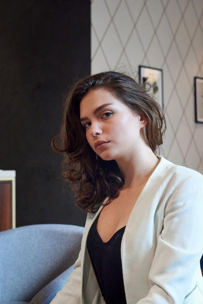 Cute young girl posing in the coffee shop