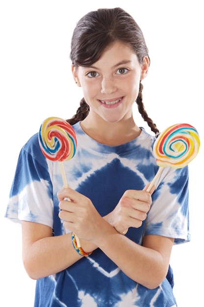 Cute young girl with two lollipops over white background