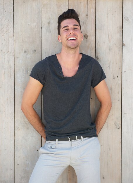 Cute young guy smiling outdoors